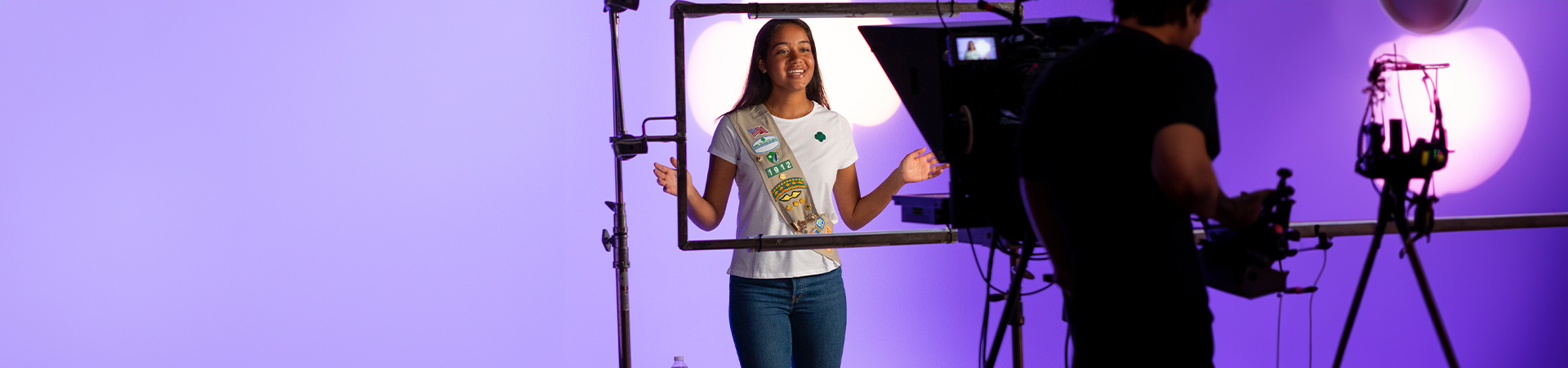  girl scout in front of tv camera 